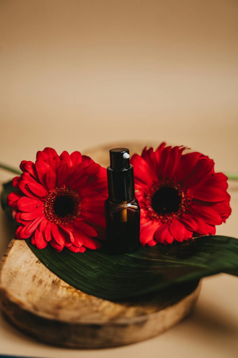 Spray Bottle Near Red Flowers